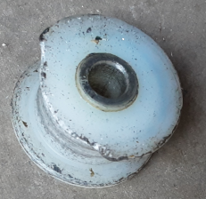 Picture of original plastic Rowbike pulley wheel with wear and damage from use